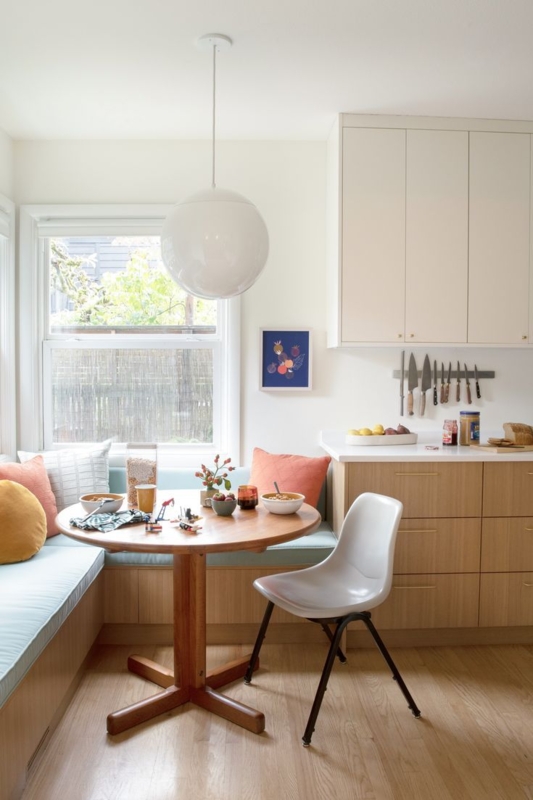 Dining Nook with Globe Pendant Lighting and Aqua Blue Seating.