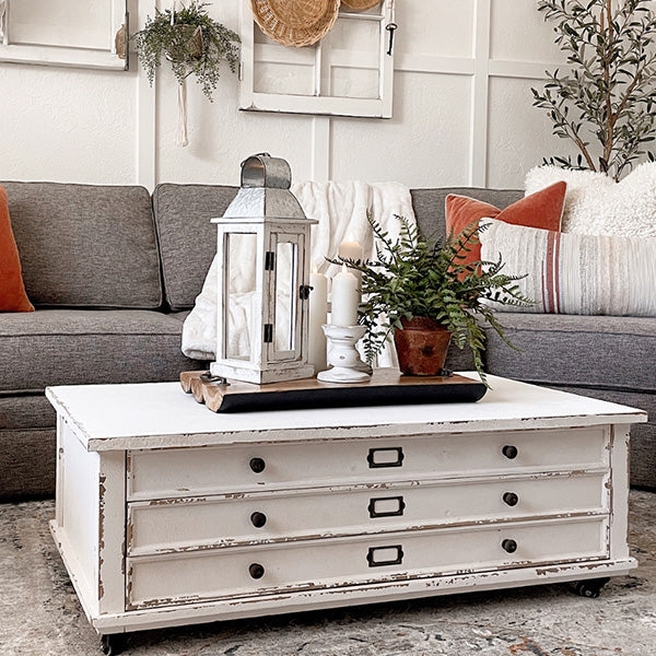 Distressed White Coffee Table on Industrial Casters: Apothecary
