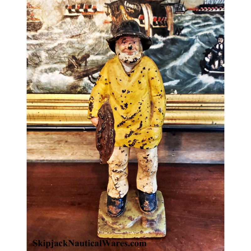 Doorstop Figurine: Vintage Cast Iron Fisherman in Distressed Yellow Slicker