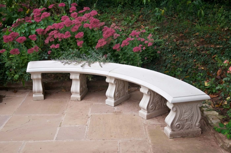 Double Curved Garden Bench: Grape Leaf Carvings, Scrolled Supports.