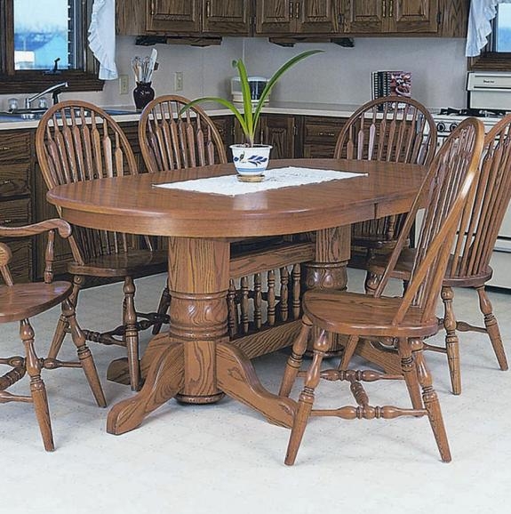 Double Pedestal Oval Table in Honey Oak with Decorative Spindle Stretcher