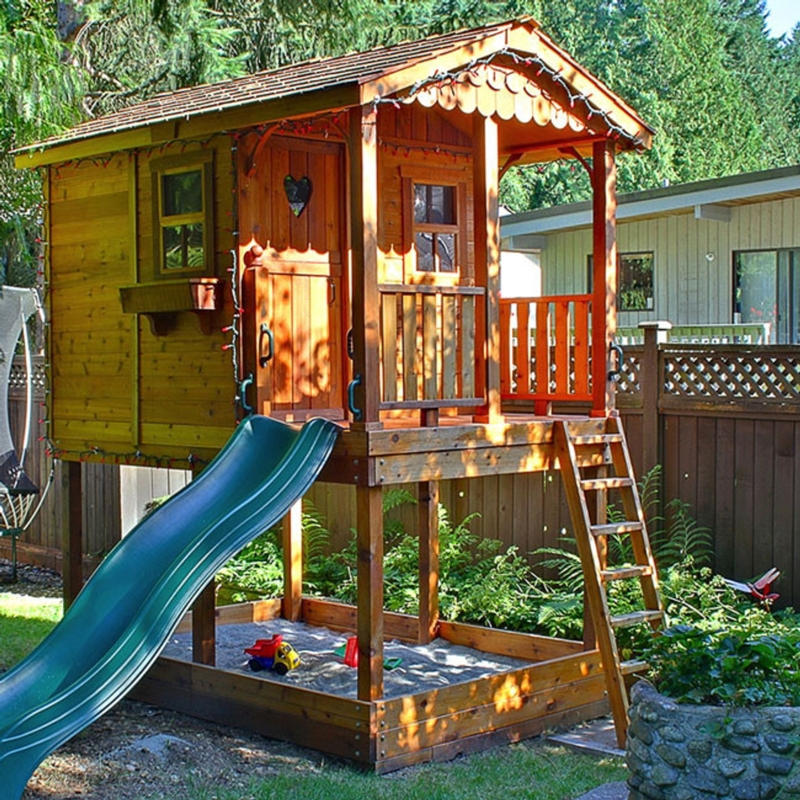 Elevated Backyard Clubhouse with Integrated Sandbox & Wavy Slide
