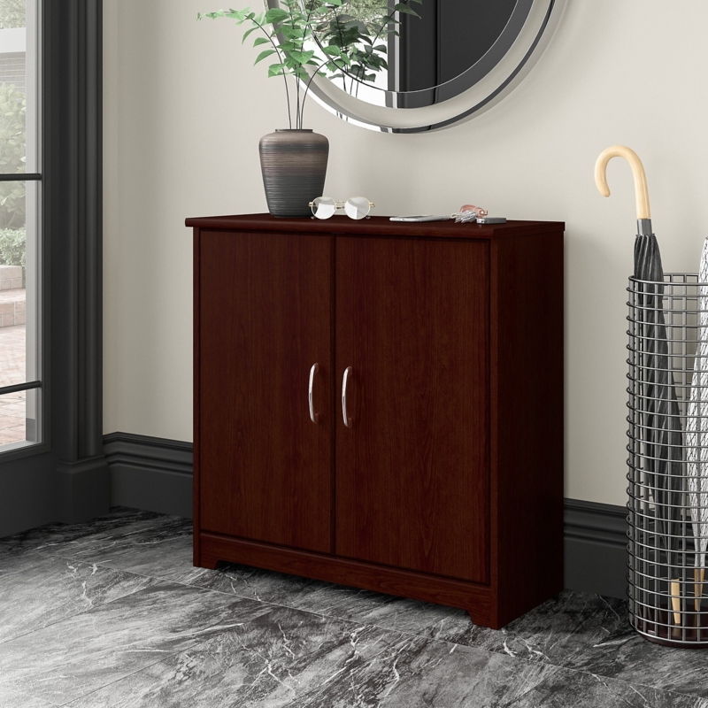 Entryway Cabinet Featuring Curved Silver Handles and Decorative Base