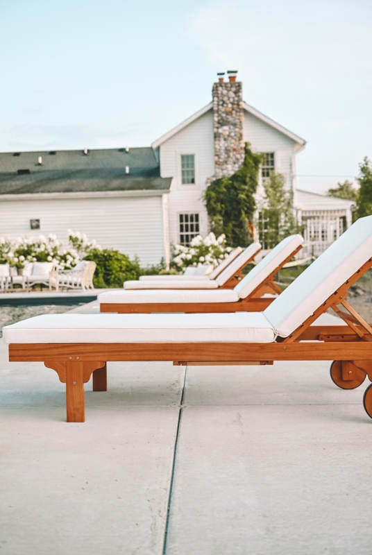 French Country Chaise Lounge with Wooden Wheels and Cushions