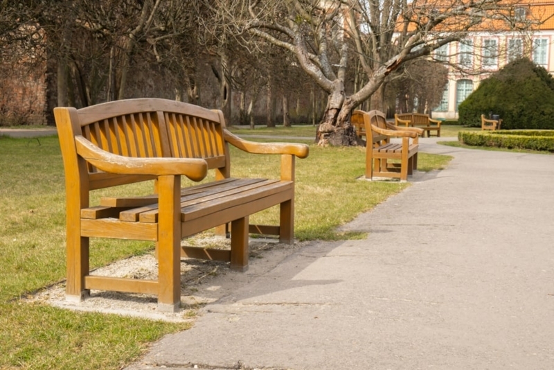 Garden Bench: Arched Top Rail, Slatted Back, Contoured Armrests.