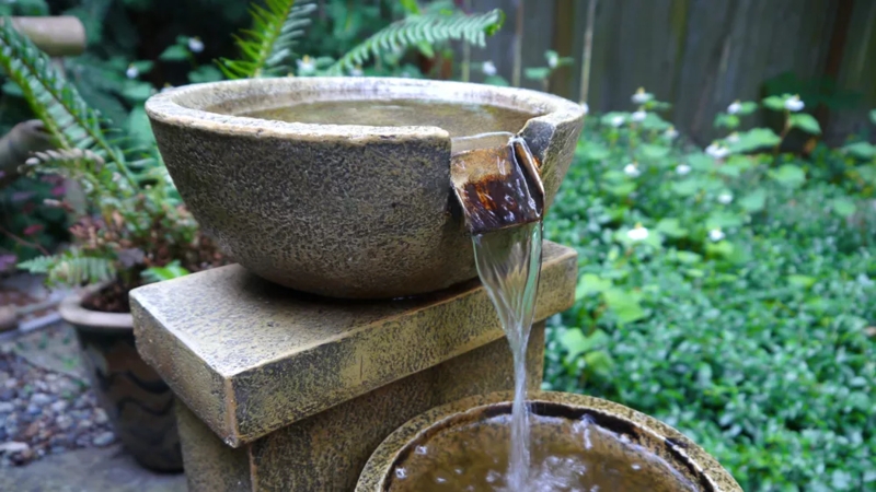 Garden Fountain: Textured Stone Finish for Tiered Backyard Feature