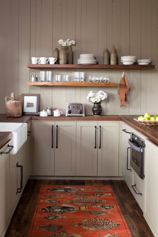 Kitchenette with Fish Pattern Rug and Vertical Wall Paneling.