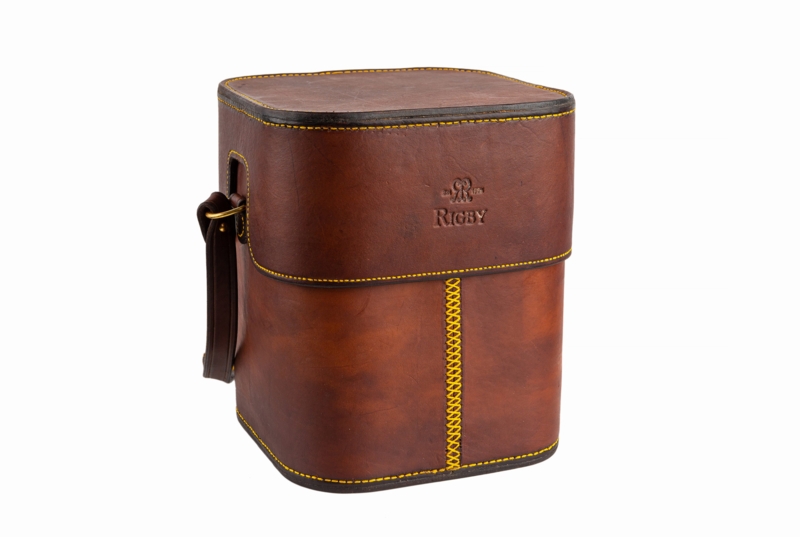 Leather Carrier: Cognac Brown Rigid Body with Mustard Yellow Stitching.
