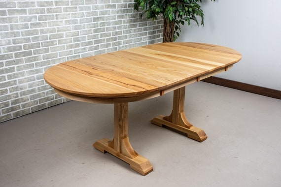 Light Wood Farmhouse Table with Expandable Oval Top and Trestle Base