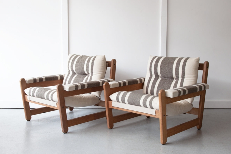 Low Slung Lounge Chair with Padded Armrests and Striped Upholstery