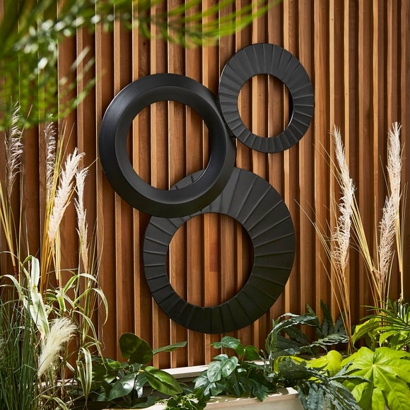 Matte Black Metal Wall Art with Sunburst Texture and Interlocking Circles