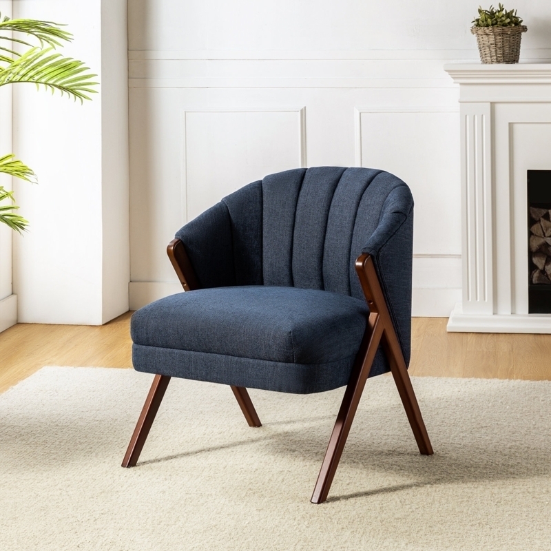 Mid-Century Armchair: Navy Blue Channel Tufted with Flared Wood Legs
