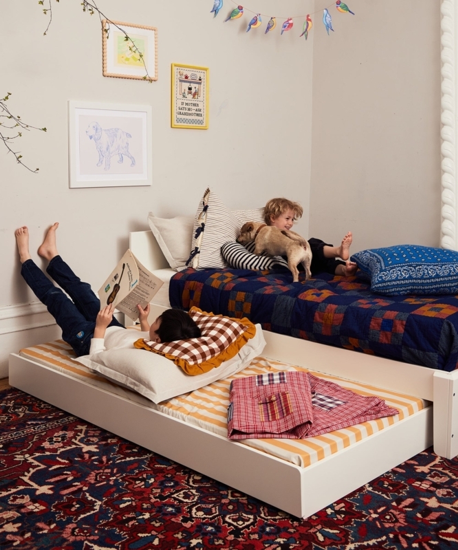 Minimalist Frame Trundle Bed with Pull Out Design and Low Profile.