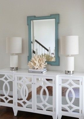 Mirrored Sideboard with Geometric Fretwork and Coastal Glam Style