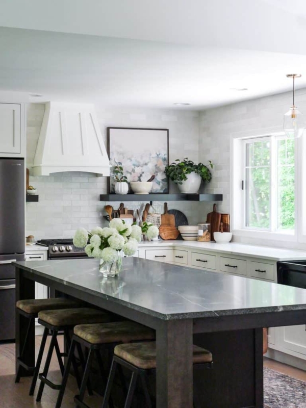 Modern Farmhouse Kitchen Island With Dark Base And Tan Stools