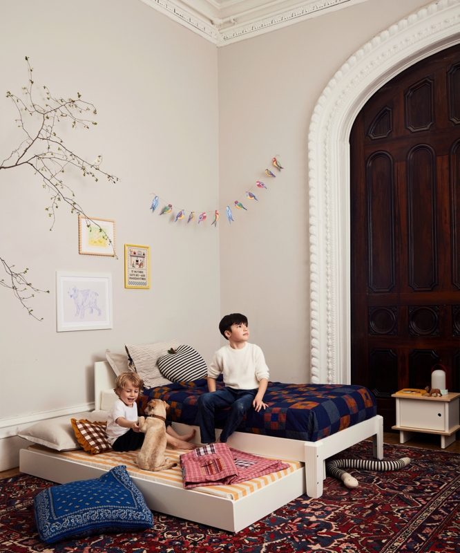 Modern Minimalist Trundle Bed in Crisp White with Rounded Edges.