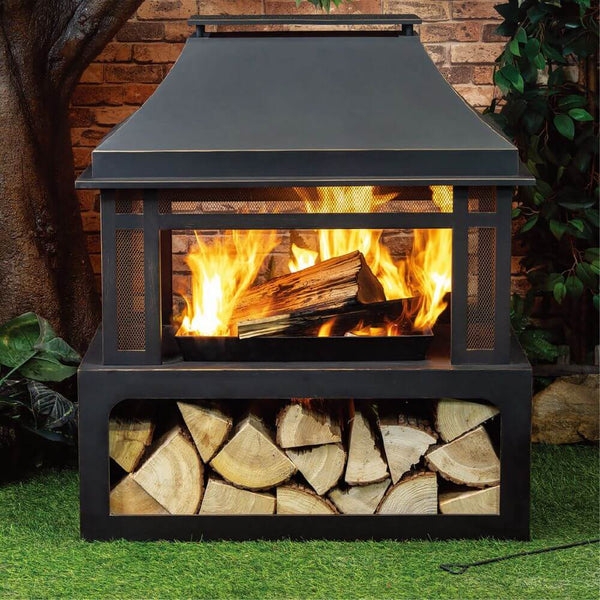 Modern Outdoor Fireplace with Sloped Metal Hood and Wood Niche