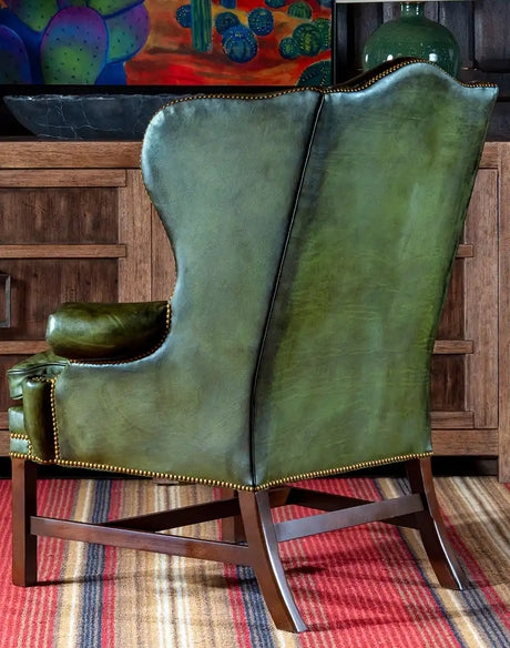 Olive Green Distressed Leather-like Wingback Chair with Brass Nailheads