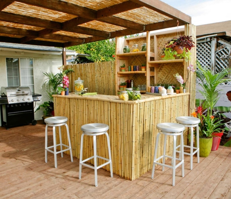 Outdoor Bar Set: Tropical Bamboo Facade with Thatched Roof.