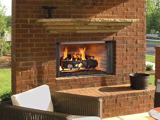 Outdoor Fireplace with Red Brick Masonry and Rough Stone Mantel