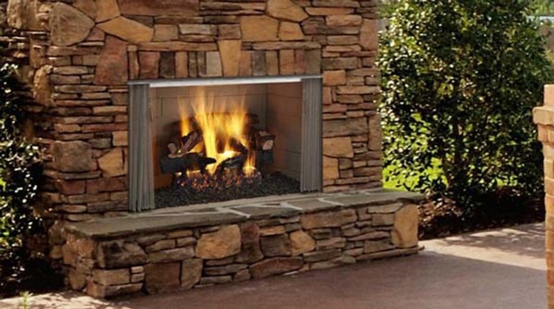 Outdoor Fireplace with Retractable Mesh Screen and Stacked Stone