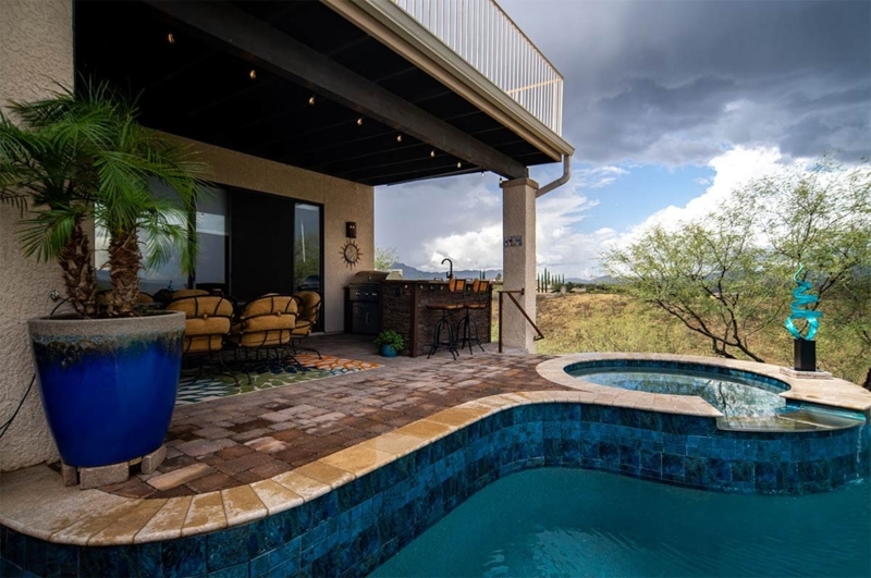 Outdoor Kitchen: Stone Veneer Bar featuring Cobalt Blue Glazed Planter.