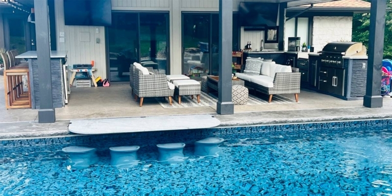 Outdoor Living Suite: Stone Cladding with Multi-Zone Layout and TVs.