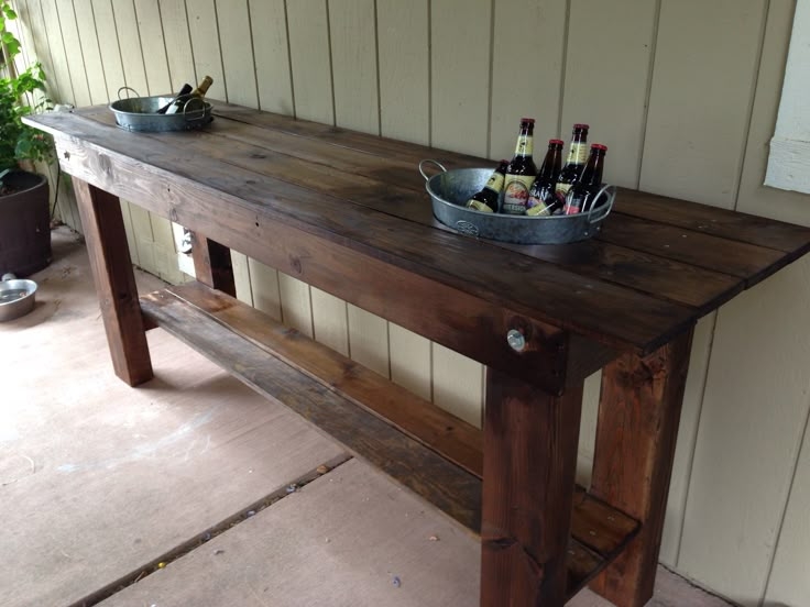 Outdoor serving table with built in ice buckets