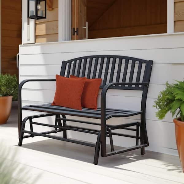 Patio Glider Matte Black Slat Back Rust Orange Accents