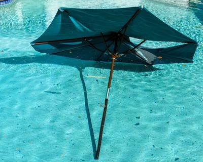 Patio Umbrella Teal Canopy Wood Toned Pole Collapsible Ribs Poolside