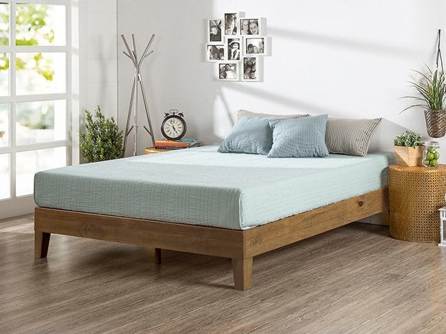 Platform Bed Featuring Natural Wood Grain Base and Tapered Legs