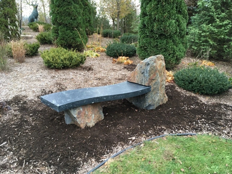 Polished Boulder Bench: Integrated Backrest, Charcoal Seat.
