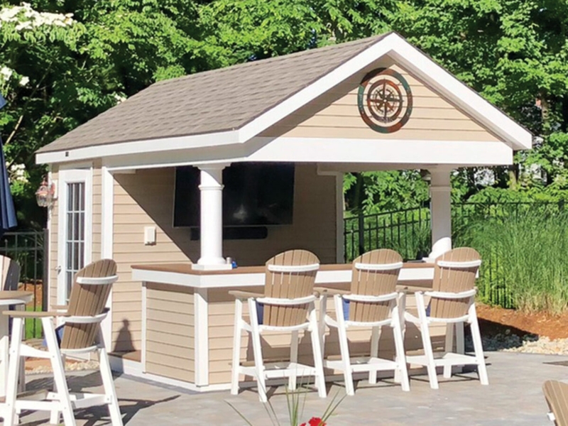Pool House Bar with Adirondack Stools and Compass Rose Decor