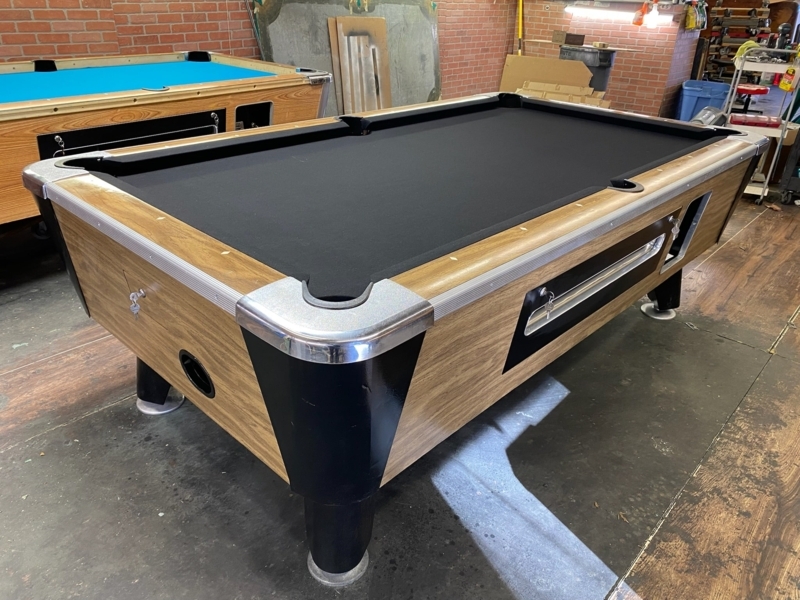 Pool Table: Matte Black Coin Operated Mechanism with Ball Return Slot.