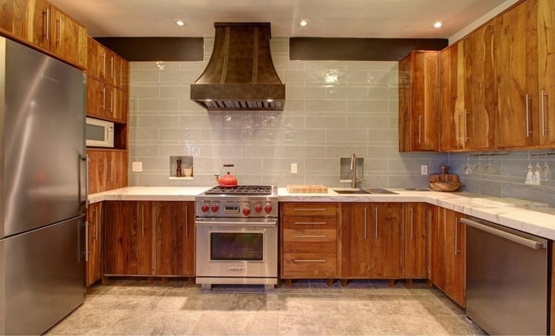 Reclaimed Teak Kitchen Cabinetry with Hammered Metal Range Hood