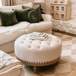 Round Ottoman with Tufted Top and Turned Wood Base