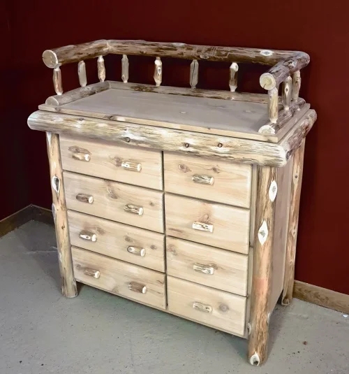 Rustic log changing table with eight drawers and branch pulls