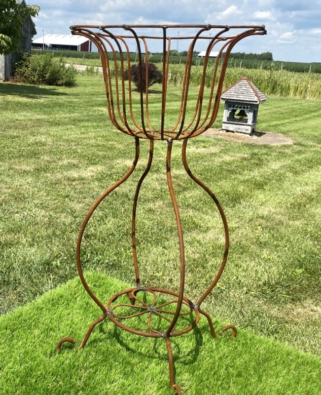 Rustic Metal Plant Stand with Hourglass Frame and Weathered Finish