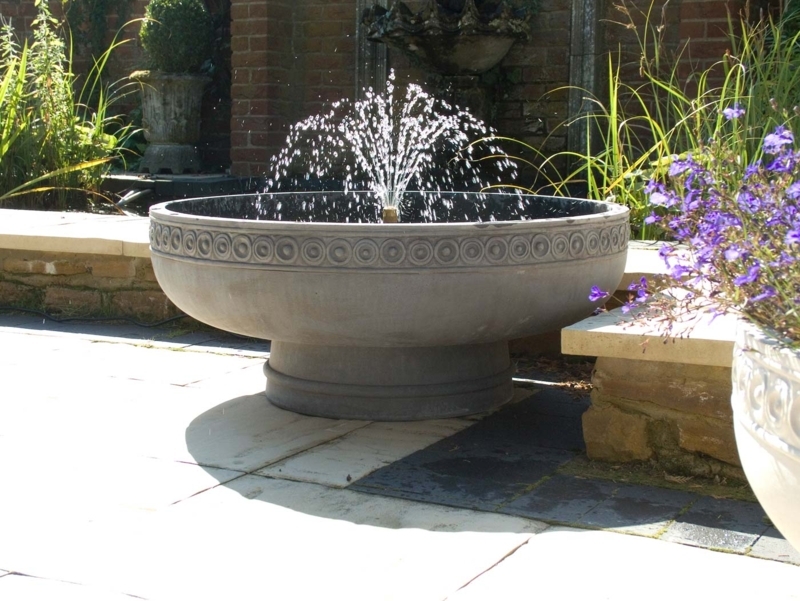 Self-Contained Fountain with Circular Relief Motif and Romanesque Style