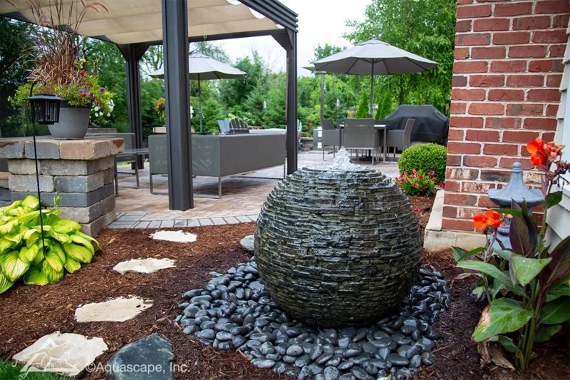 Sphere Fountain with Stacked Slate Texture and River Rock Base