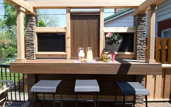 Spiced Rum Outdoor Bar with Stone Columns and Integrated Pergola
