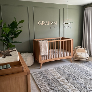 Spindle Side Mid-Century Crib with Tapered Legs in Warm Wood Tone