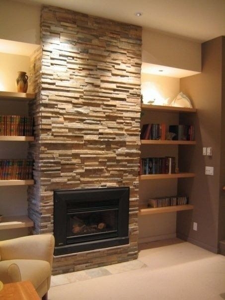 Stacked Stone Fireplace Surround with Built-In Floating Wood Shelves