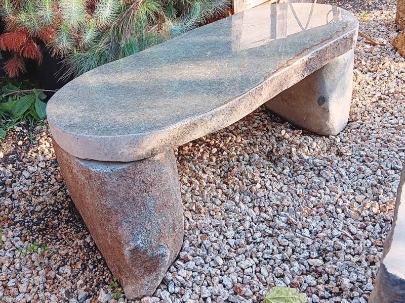 Stone Bench: Boulder Style Legs, Polished Oval Top, Natural Grain.