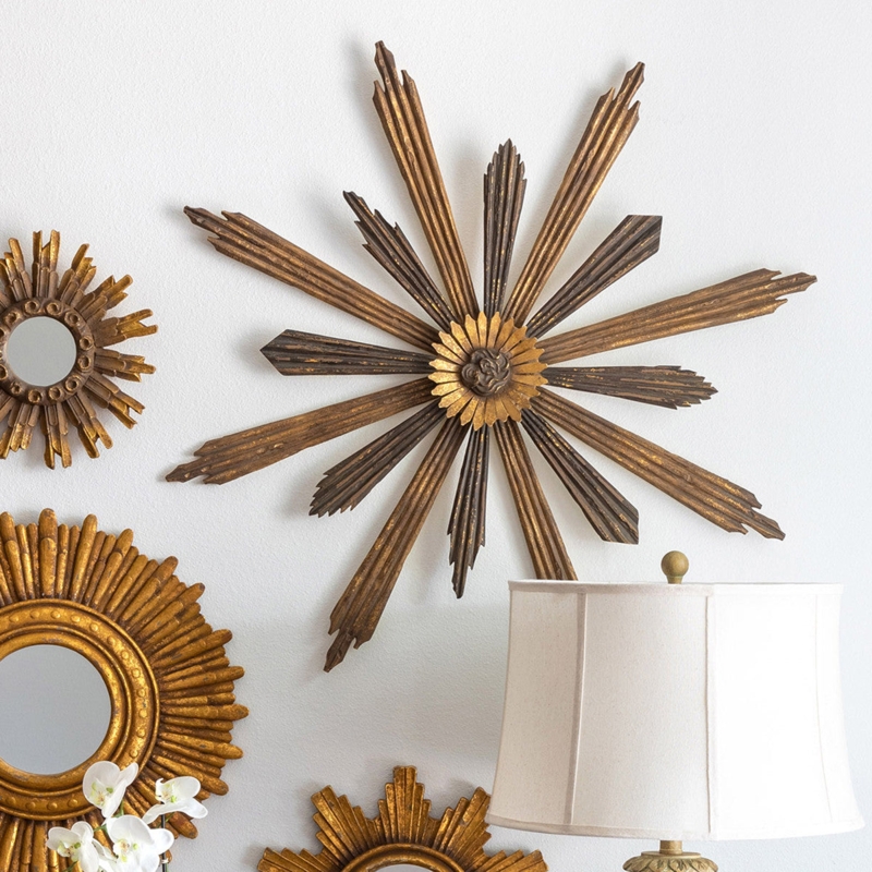 Sunburst Wall Decor featuring Asymmetrical Rays and Floral Center