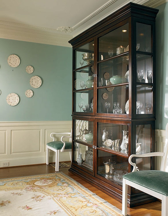 Tall Display Cabinet with Four Doors, Glass Shelves, and Plinth Base