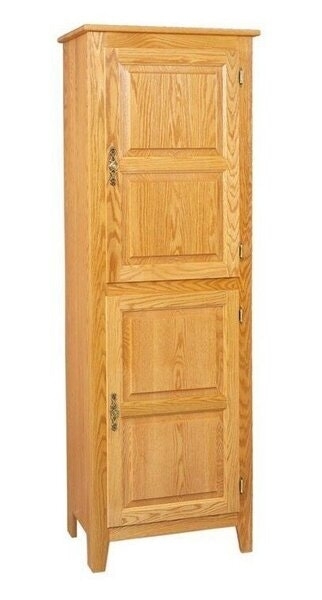 Tall Kitchen Pantry with Decorative Latches and Crown Molding