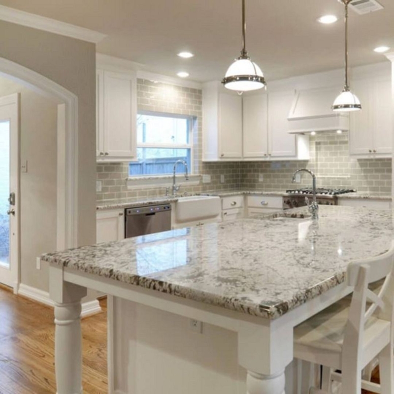 Traditional Kitchen Island With Turned Legs And X-Back Chairs