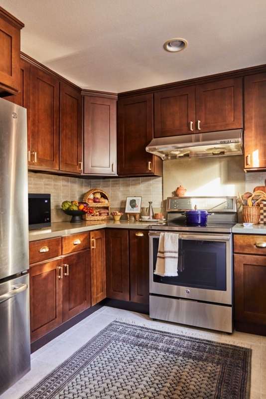 Transitional Kitchen Cabinets with Brass Hardware and Cup Pulls