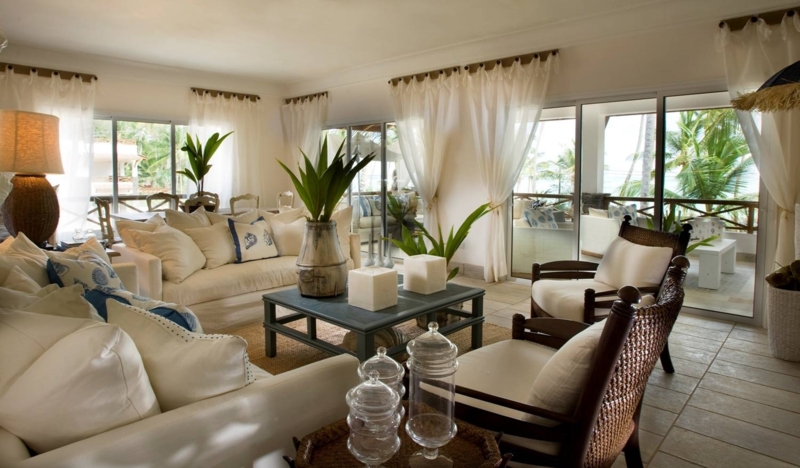 Tropical Living Room with Rattan Back Chairs and Nautical Print Pillows